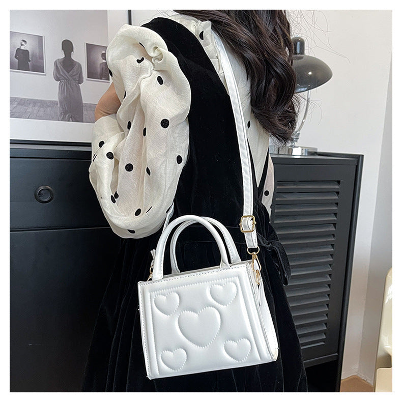 1pc Women’s Stylish Solid Color Handbag with Detachable Strap – Heart Pattern Design, Perfect for Valentine’s Day Gift, Available in Magenta, White, Black, Green, Yellow